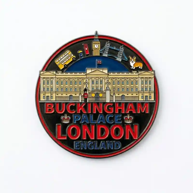 A souvenir medal featuring Buckingham Palace with London landmarks such as Big Ben, a red double-decker bus, a post box, Tower Bridge, and a Corgi dog.
