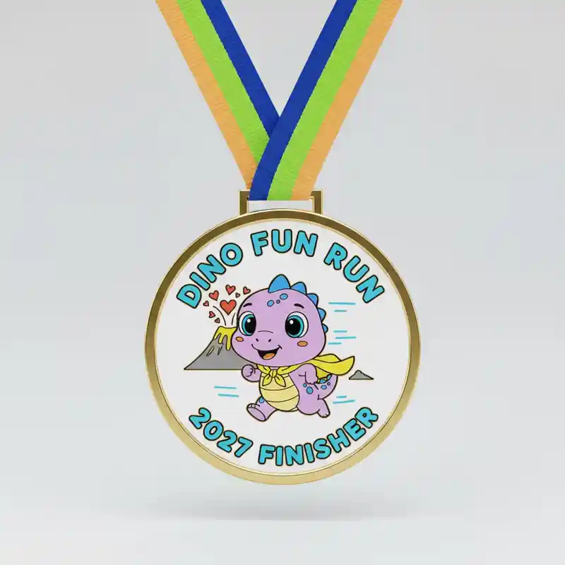 Custom metal finisher medal featuring a cute cartoon dinosaur mascot running with volcano and hearts, Dino Fun Run 2027 medal with colorful ribbon