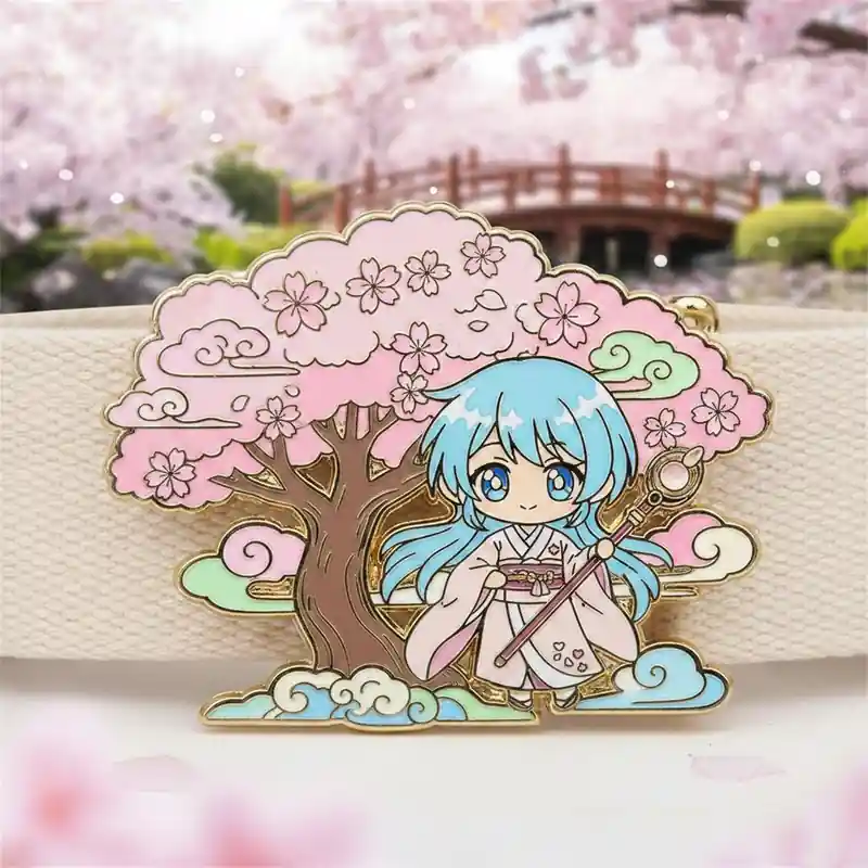 Gold-plated enamel pin featuring a blue-haired anime girl in a kimono holding a staff, standing under a pink cherry blossom tree with decorative clouds, set against a soft spring garden background.