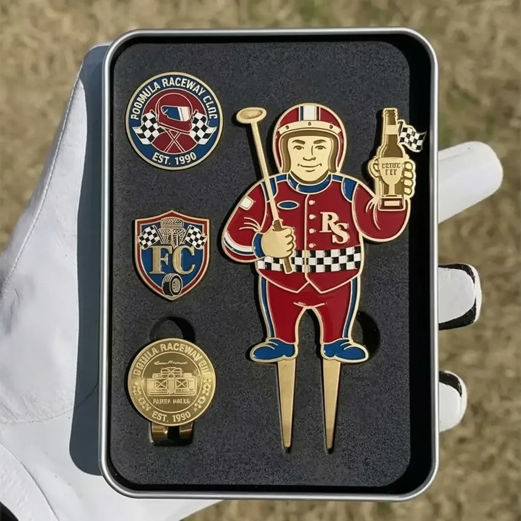 A colorful racing driver themed golf divot tool set with checkered details and matching raceway logo pins arranged in a presentation case.