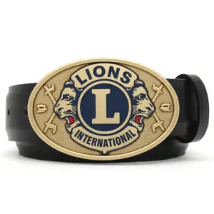 A gold oval belt buckle featuring the Lions International logo with two lion heads facing opposite directions and a central “L” emblem.