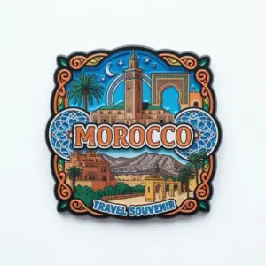 A colorful Morocco souvenir pin featuring a mosque, archway, palm trees, and mountains with decorative patterns and “Morocco Travel Souvenir” text.