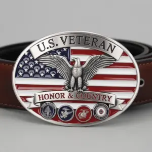 An oval belt buckle displaying a bald eagle over the American flag with the words U.S. Veteran Honor & Country and military branch emblems.