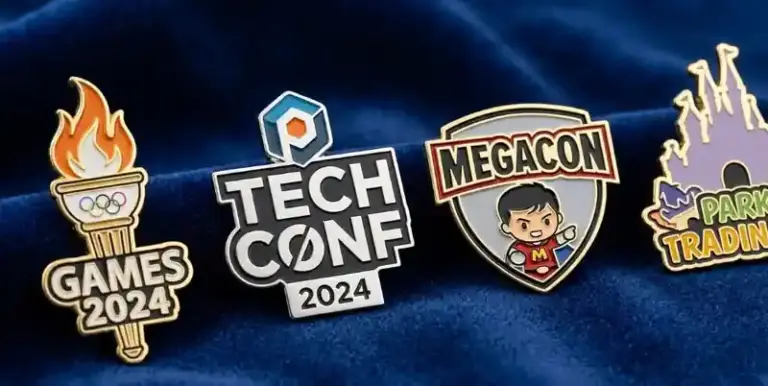 Collection of custom enamel pins featuring event logos such as Games 2024 torch, Tech Conference 2024, Megacon character badge, and theme park trading pin.