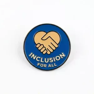 Round enamel fridge magnet featuring a handshake inside a heart symbol with the words "Inclusion for All" on a blue background.