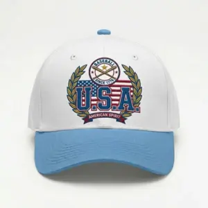 White and light blue baseball cap featuring a USA baseball emblem with laurel wreath, crossed bats, and the text “U.S.A. American Spirit – Baseball Since 1776.”