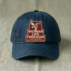 Navy blue baseball cap embroidered with “Woman Life Freedom Global Solidarity For A Sovereign Future” featuring a raised fist and dove with olive branch.