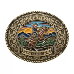 Western belt buckle featuring cowboy riding a horse with desert landscape, mountains and cactus, Cowboy Way design.