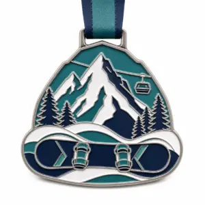 Alpine snowboard badge snowboard medal soft enamel medal with raised silver metal outlines, teal and white mountain details, and a connected ribbon loop on white.