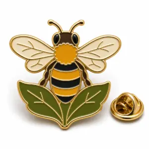 Bee-shaped garden enamel badge with attached wings and leaf base, gold metal dividers, and butterfly clutch.