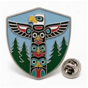 Custom cedar pole eagle shield soft enamel pin with stacked connected forms, raised metal color dividers, and butterfly clutch.
