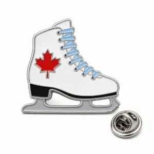 Custom figure skate maple soft enamel pin with silver outlines and butterfly clutch on a white background.