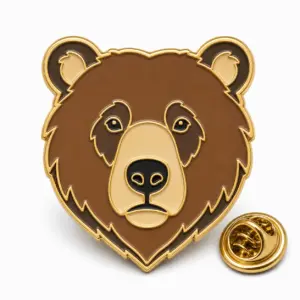 Custom grizzly bear head soft enamel pin with gold outlines and butterfly clutch on a white background.