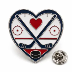 Custom hockey mom heart soft enamel pin with silver outlines and butterfly clutch on a white background.