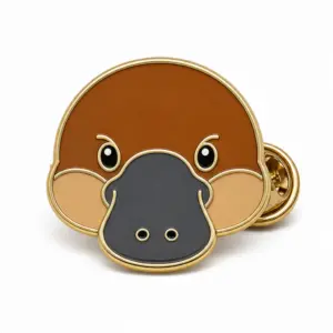 Custom platypus face soft enamel pin with raised metal outlines and butterfly clutch on a white background.