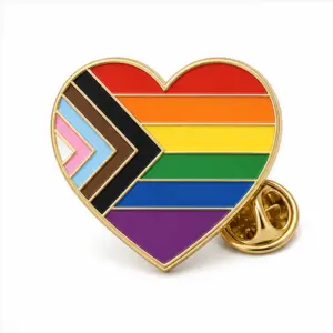 Custom rainbow ally heart soft enamel pin with raised metal outlines and butterfly clutch on a white background.