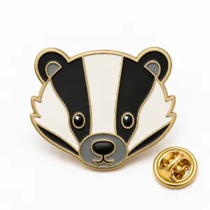 Custom badger face soft enamel pin with butterfly clutch on clean white background.