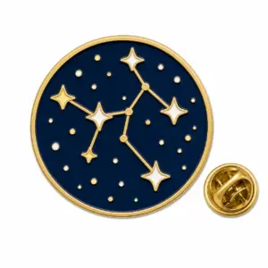 Custom round night constellation soft enamel pin with butterfly clutch on white background.