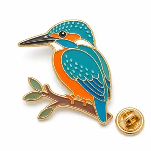 Custom kingfisher branch soft enamel pin with butterfly clutch on clean white background.