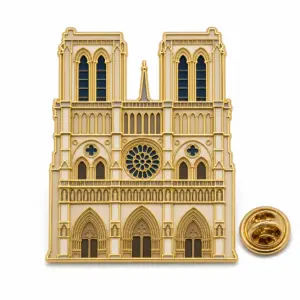 Custom Notre Dame Cathedral front soft enamel pin with butterfly clutch on clean white background.