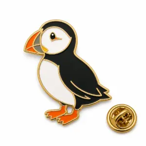 Custom standing puffin soft enamel pin with butterfly clutch on clean white background.