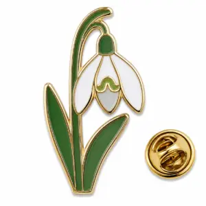 Custom single snowdrop flower soft enamel pin with butterfly clutch on clean white background.
