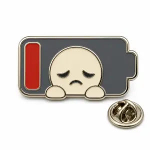 Custom social battery soft enamel pin with low energy gauge and butterfly clutch on white background.