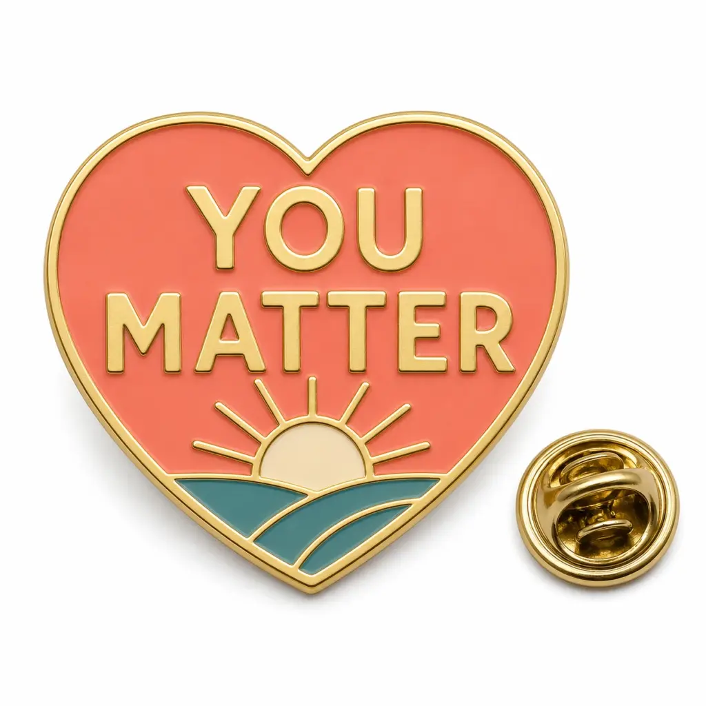 Custom You Matter heart sunrise soft enamel pin with butterfly clutch on clean white background.