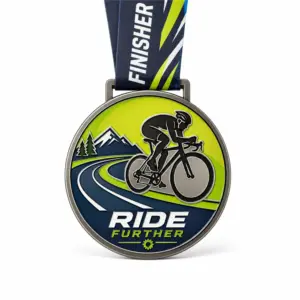 Ride Further mountain Cycling Medal soft enamel medal with raised dark metal outlines, cyclist silhouette, lime green mountain route, navy road, finisher neck ribbon, ribbon loop, and white background.